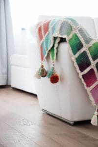 Hand knitted rainbow blanket
